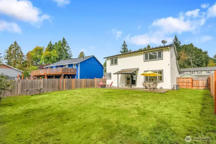 Fully fenced yard with ample space for play, gardending, or pets.