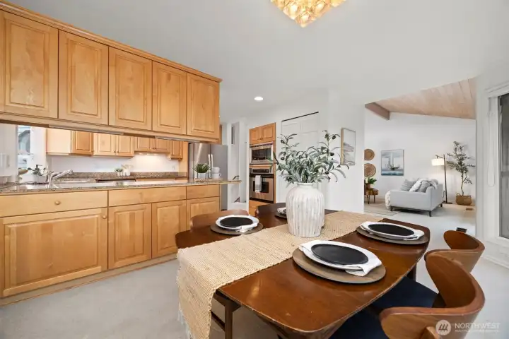 There is a spacious dining room with lots of storage in the cabinets on the back side of the kitchen.