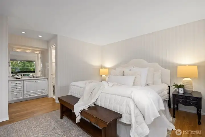 There is a large vanity with a separate shower and toilet room off the primary bedroom.