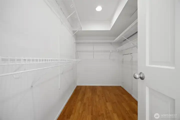 The walk-in closet is generously sized and has a small door that opens for additional dormer storage space. This condo has a LOT of storage.