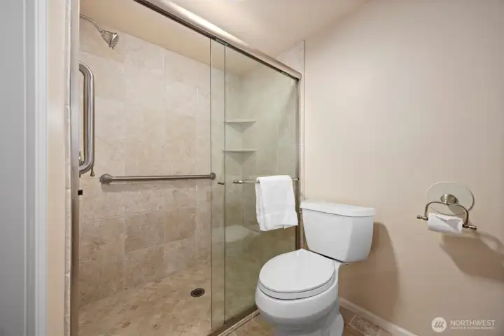 The other 3/4 bath on the lower level was also updated with travertine tiles and is very lovely.