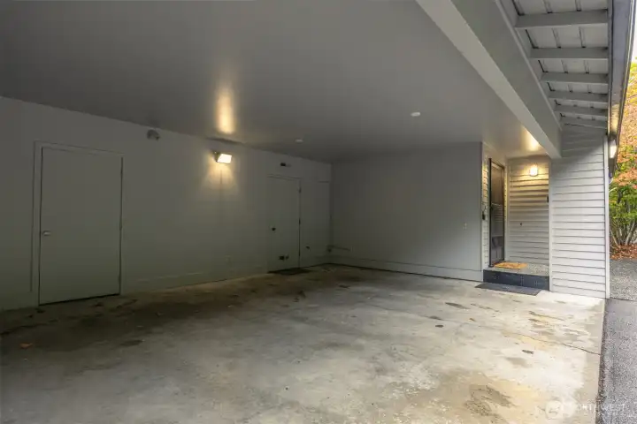 Another view of the two parking spaces and the storage closet to the far right near the front entry.