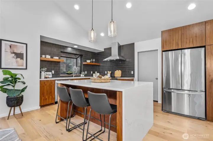 Gorgeous kitchen with custom cabinets, quartz, designer tile and SS appliances