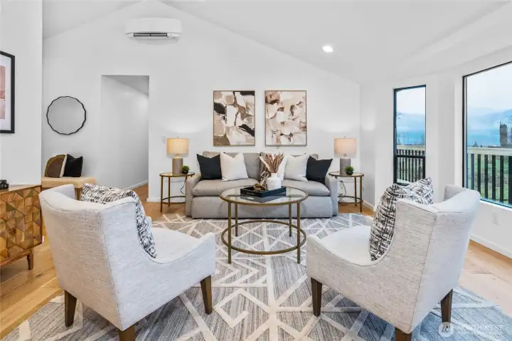 Living room on main floor with wall of windows to the foothill views
