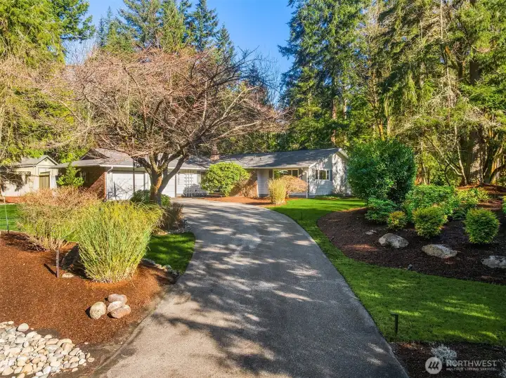 Nestled on the corner of a large 3/4 acre lot with adjacent cul-de-sac