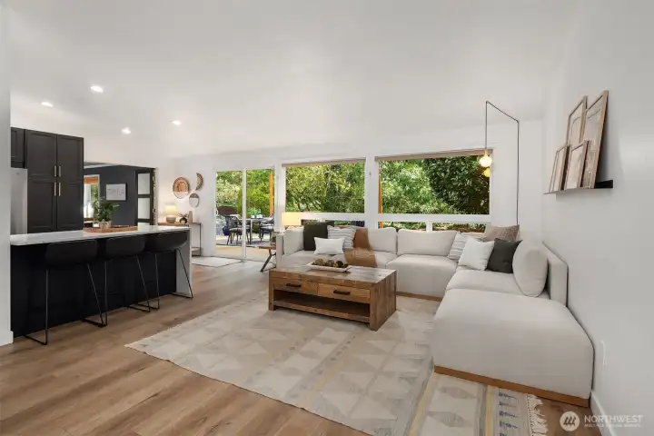 Inviting family room with engineered flooring throughout much of main home