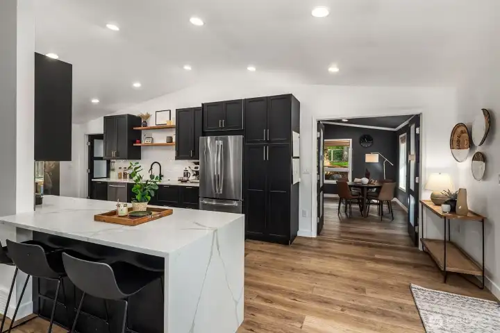 Open layout integrates the family room and kitchen while offering additional seating at the breakfast bar