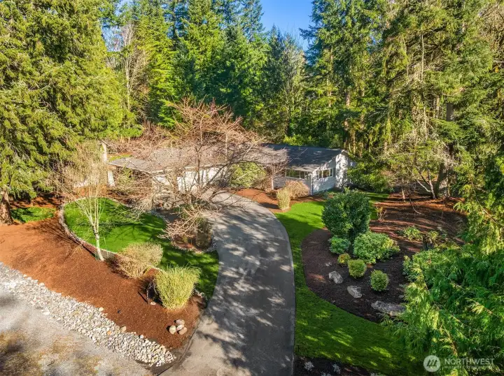 Beautifully landscaped lot offers seasonal color throughout the year
