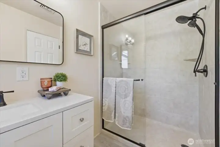 Enjoy a completely remodeled primary bath with stylish shower updates.