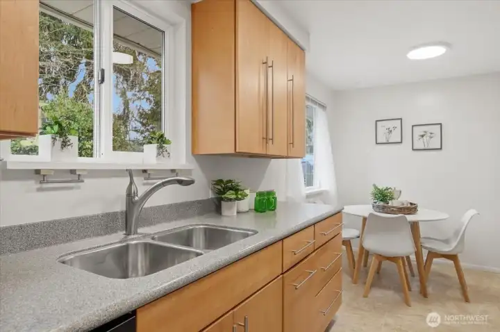 Charming over the sink window allow for looking out and over your enchanting back yard!