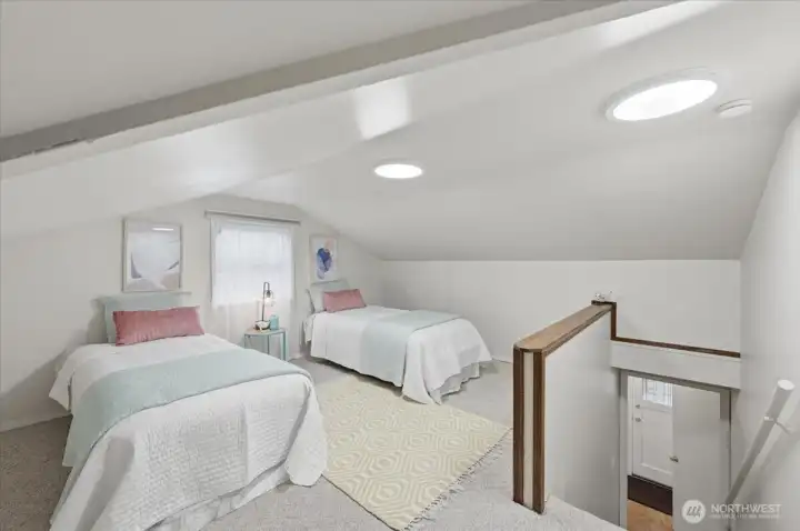 Upstairs 1/2 story, whimsical third bedroom great for whatever you choose; children, guests, art studio, home office and or even primary if whimsical is your thing!  3/4 bath located just at bottom of stairway,  There is a closet located in this bedroom as well.  I know as a child, and even as an adult, this room would be a place I'd love to call home - mind you I am 5"3 haha!  Freshly painted ceiling and walls!