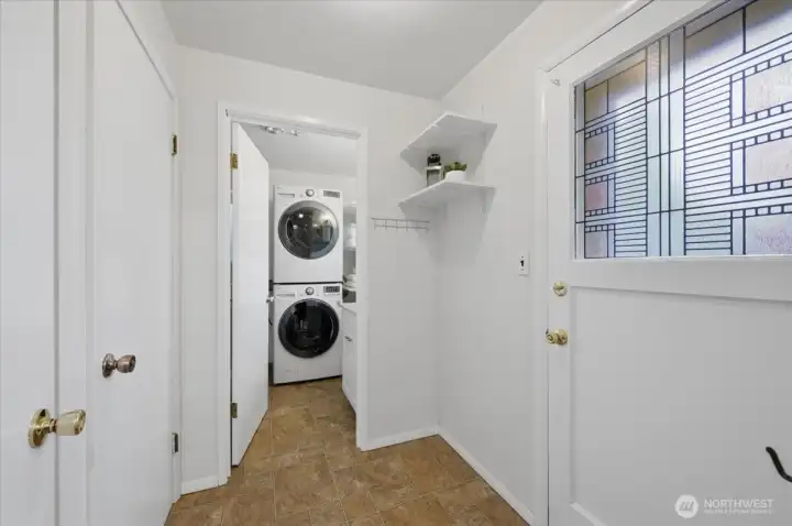 This area, just outside kitchen area you'll find 3/4 bath with laundry, entrance to upstairs bedroom, entrance to secondary living room and door to back yard.  Great place for brooms, coats, shoes (AKA Mud room).