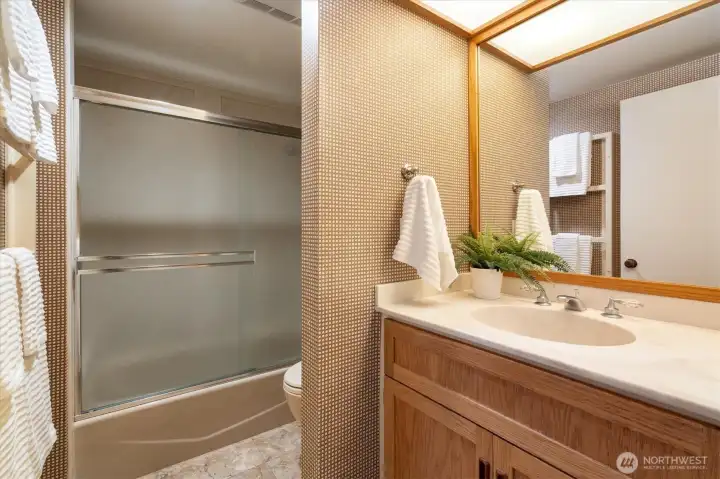 Full bathroom with marble floors