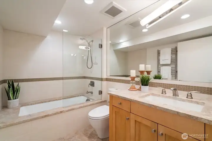Updated full bathroom with marble floors