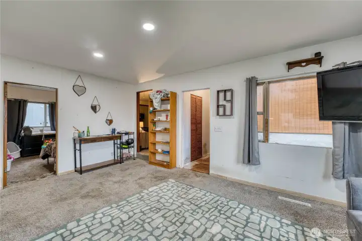 Family room with updated can lighting.