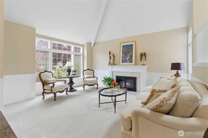 Vaulted ceilings and recessed lighting elevate the home throughout, enhancing volume and natural light while creating a bright and inviting atmosphere throughout.