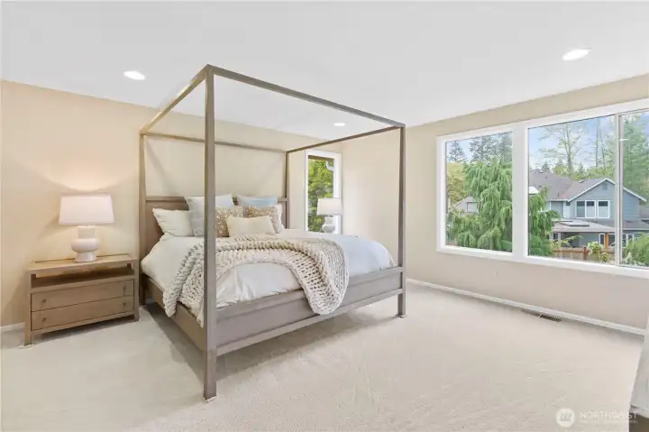 The primary bedroom suite offers a truly luxurious retreat, complete with a private en-suite full bathroom and a sense of quiet seclusion.