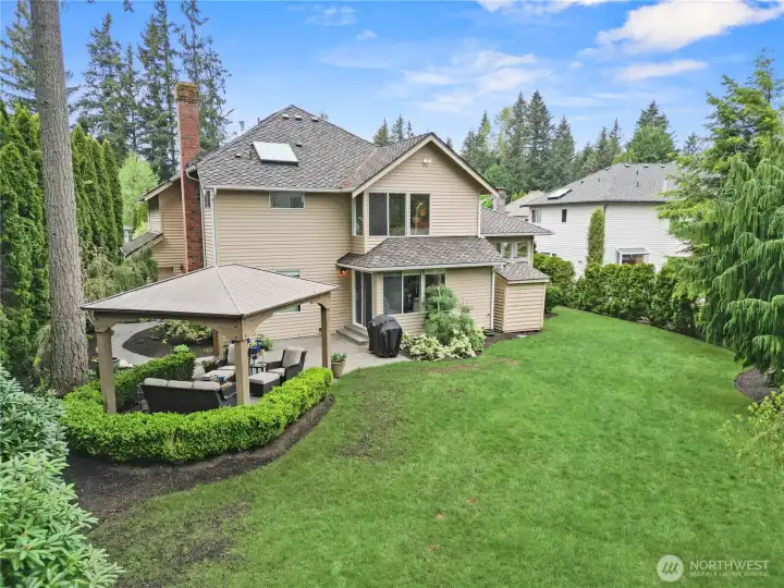 Set on an expansive ~10,000 sq ft lot, the grounds offer a sense of privacy and greenery, with a gazebo for summer evenings, pre-wiring for a hot tub, and a sprinkler system designed for effortless upkeep.