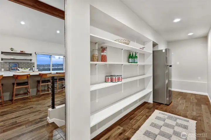 Spacious walk-in pantry and mud-room, space for all the things.