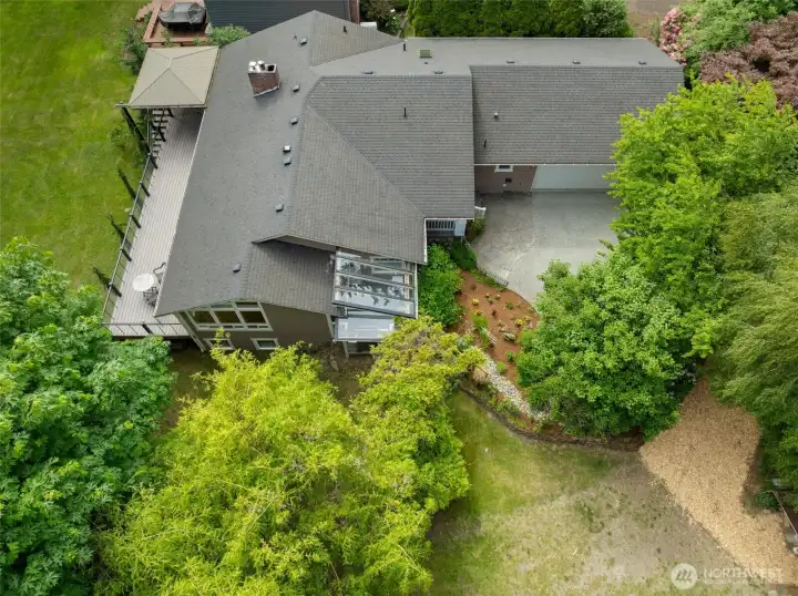 Indoor & Outdoor Living Combined. Expansive decks and peaceful surroundings create a true Northwest retreat.