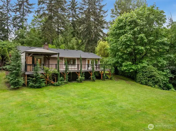 Expansive lawn and park-like grounds create a truly private retreat.