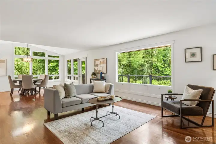 Spacious living area with expansive picture windows and peaceful views.