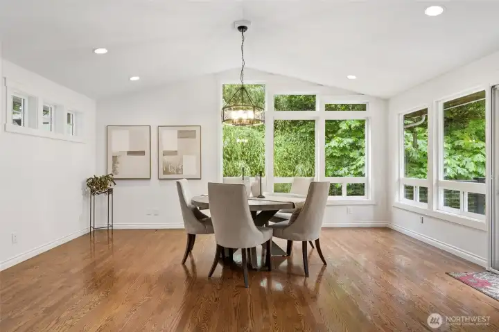 Spacious dining room with vaulted ceilings and impeccable views.