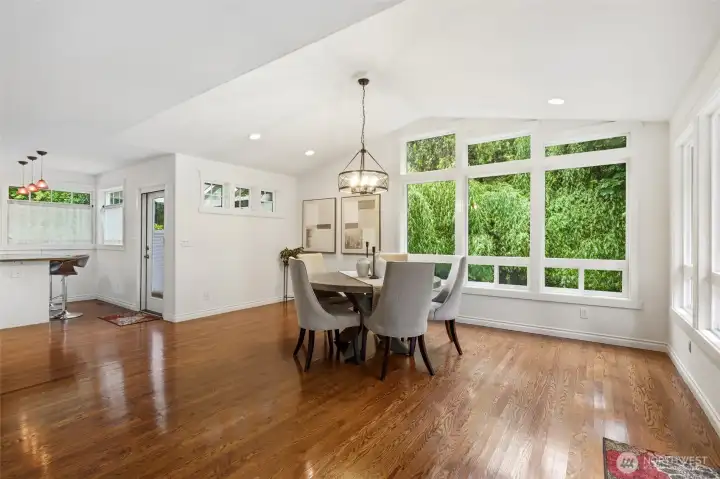 Vaulted ceilings and oversized windows create an airy feel.