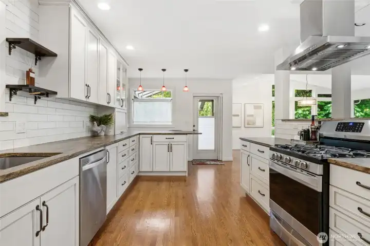 Spacious open kitchen design with access to outdoor entertaining.