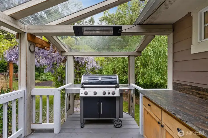 Enjoy outdoor dining and grilling beneath the covered patio.