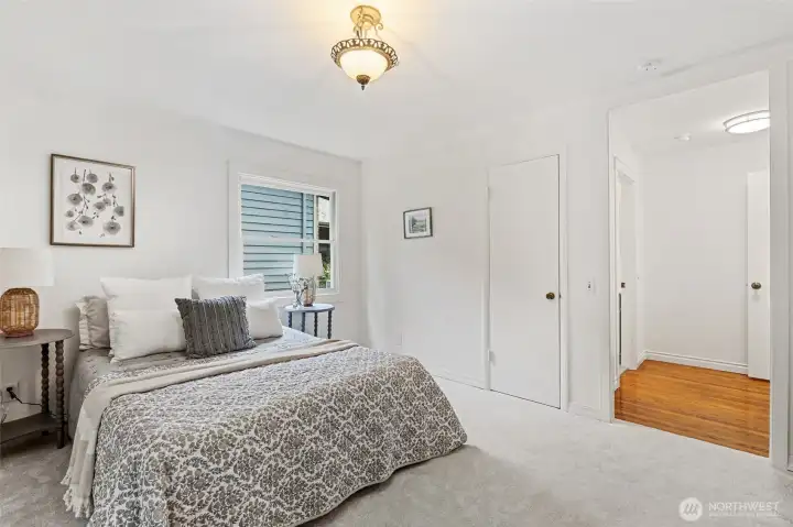 Spacious bedroom with abundant natural light.