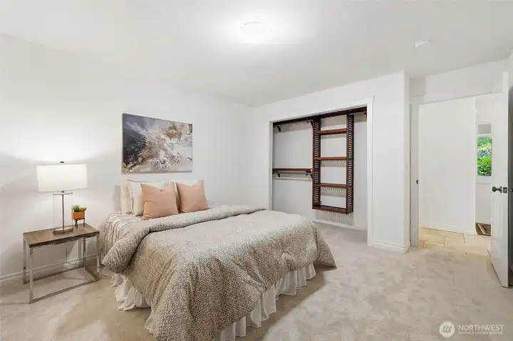 Spacious bedroom with an organized closet layout.