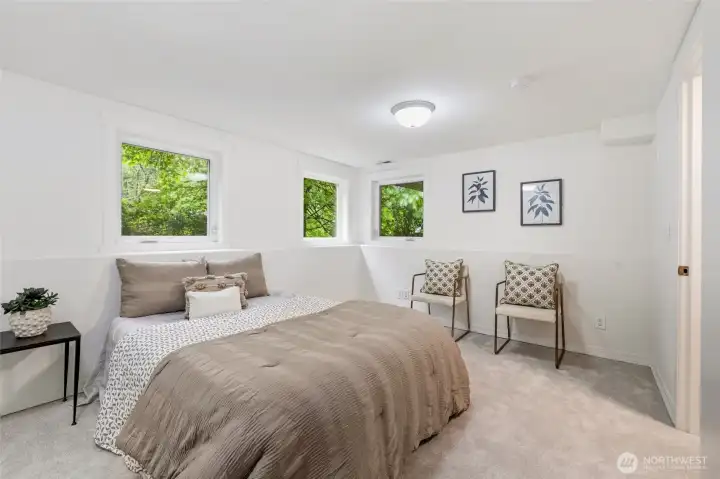 Bright bedroom with peaceful garden views.
