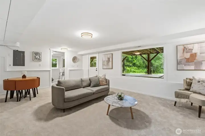 Spacious living area overlooking peaceful scenery.