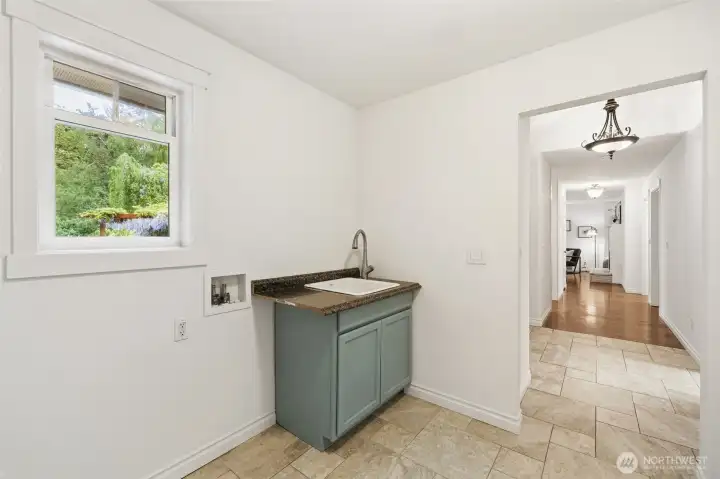 Versatile utility space with sink and natural light.