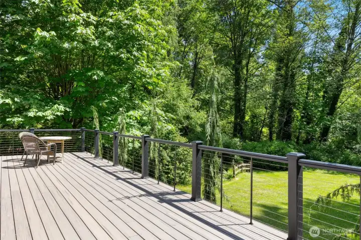Designed for Easy Outdoor Living. Expansive Trex deck and upgraded railing overlooking peaceful natural surroundings.