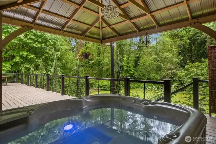 Relax and unwind in the private spa with tranquil views.