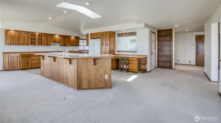 The kitchen island has room for 7+ stools at the breakfast bar!