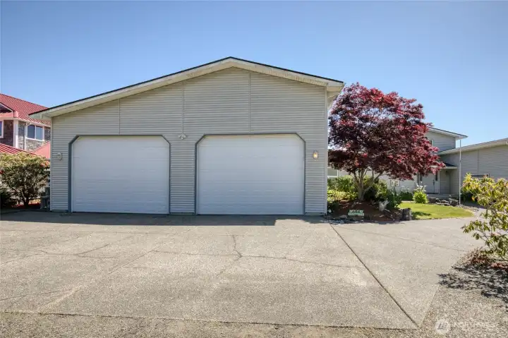 RV garage features 12 foot high doors and has space for 8 full size vehicles!