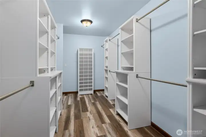Primary walk-in closet. Primary walk-in closet.
