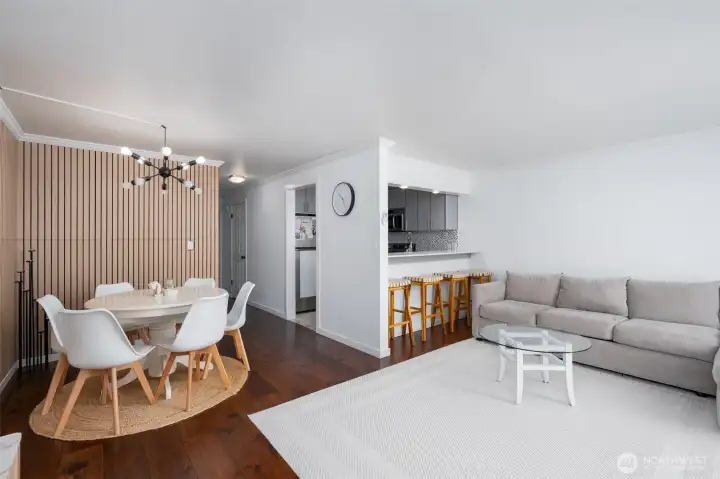 Kitchen complete with a eat at bar and living room area close by perfect for conversation while meal prep is happening.