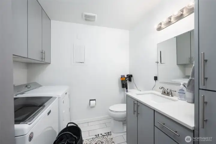 Main floor bathroom with laundry room and plenty of storage!