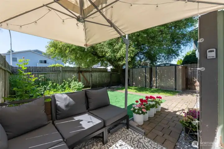 Enjoy this backyard all year round! Artificial turf is easy clean up and maintenance and fully fenced!