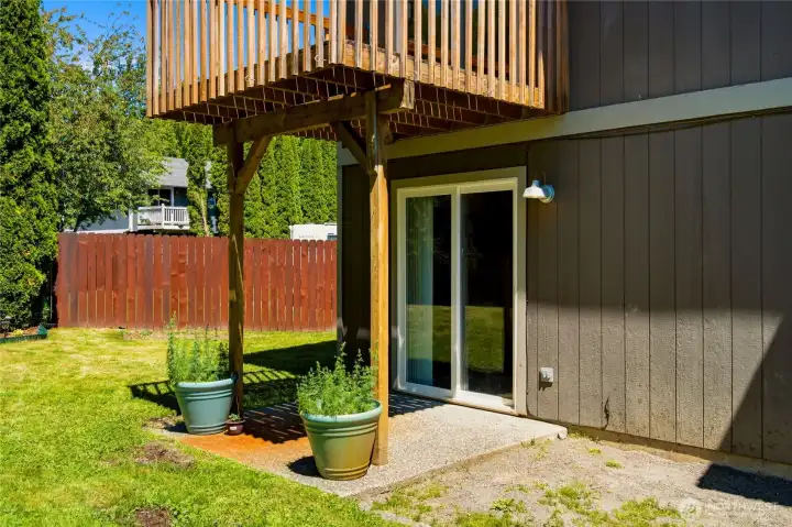 Out the sliders is a small covered patio Out the sliders is a small covered patio