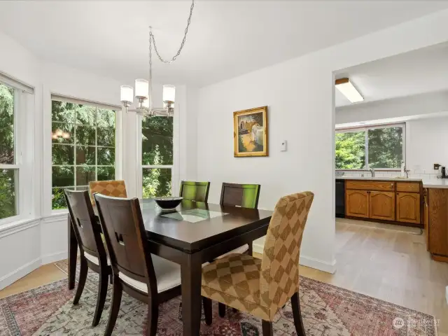 Kitchen is just steps away from this formal dining room space with plenty of windows and natural light.
