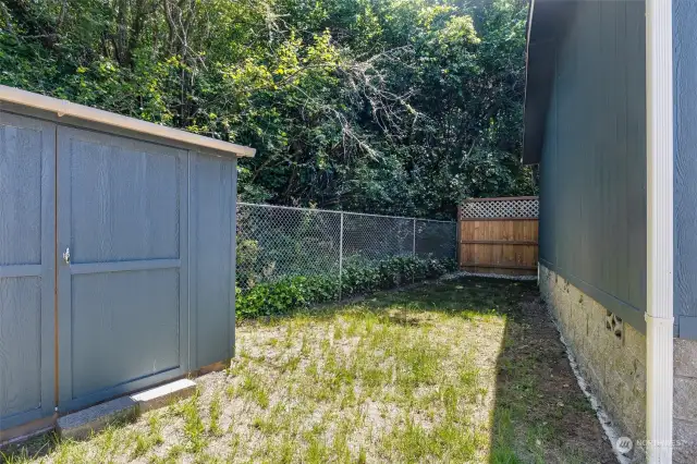 Enjoy outdoor living in the partially fenced backyard, ideal for gardening, entertaining, or simply soaking up the sun in your private sanctuary. You'll find the Chehalis Western Trail behind the trees!