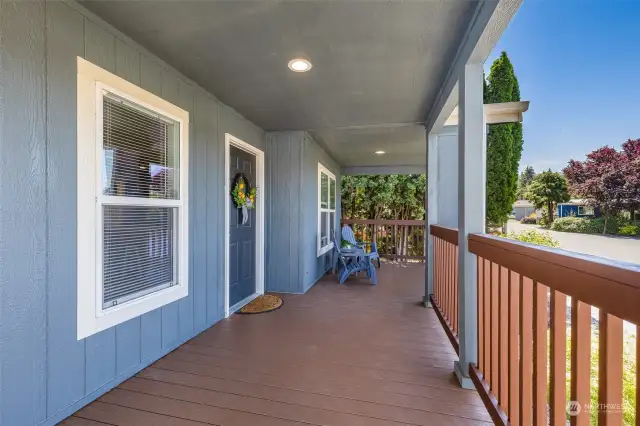 The expansive covered front porch w/durable Trex decking is perfect for enjoying the outdoors, no matter the weather.