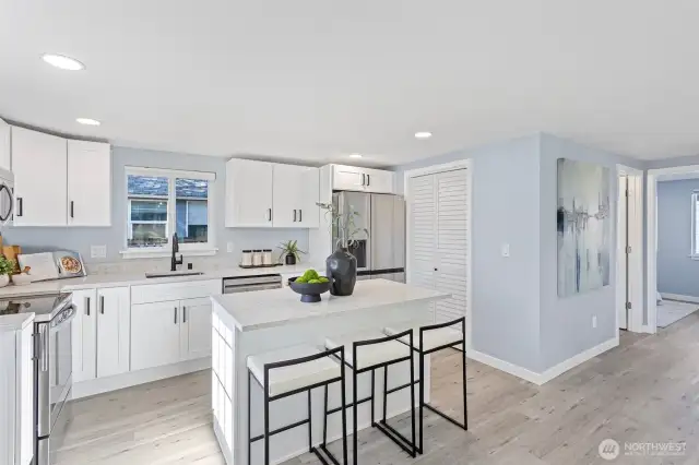 loads of storage space in the soft close cabinets with eye catching hardware and let's not miss the gorgeous quartz countertops.