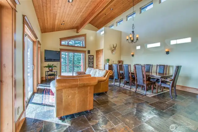 Vaulted ceilings, natural wood, slate flooring, natural light.