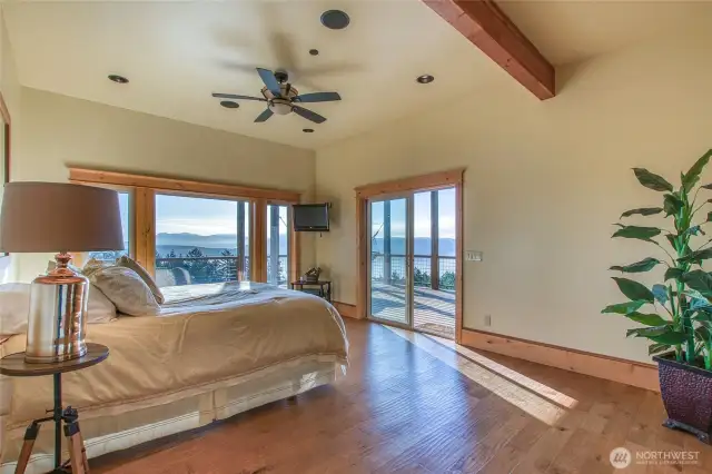 Main ensuite on lower level with sliding door opening to wrap-around deck welcoming endless days to dream. Wildlife and natural environment are your audience.